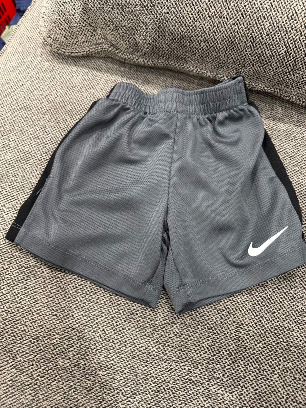 Nike Gray Athletic Shorts with White Swoosh